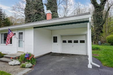 Covered area infornt of garage protects you from t