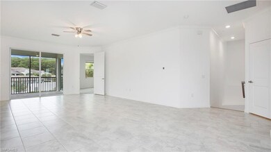 Spare room with a ceiling fan, crown molding, and recessed lighting