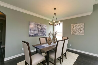 Imagine holiday meals in this dining room with stunning chandelier.
