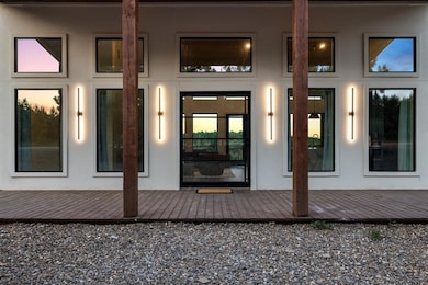 Doorway to property with a wooden deck