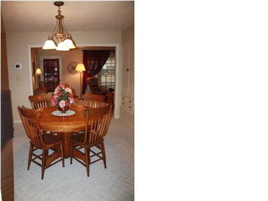 Dining room with updated lighting.
