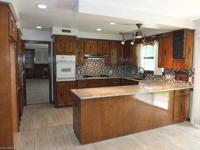 Kitchen has wall oven, gas countertop range, dishw