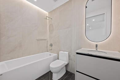 Bathroom featuring vanity, shower / bathtub combi