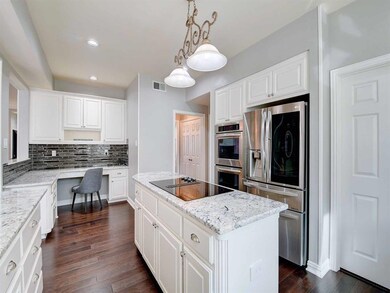 Beautifully updated kitchen with gorgeous granite and updated appliances.