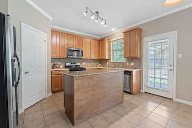 Kitchen with appliances with stainless steel fini