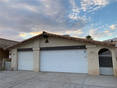 Property exterior at dusk featuring a garage