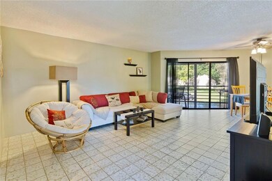 LIVING ROOM OPEN TO OVERSIZED SCREENED AND ROOFED