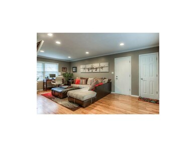 Cozy Family Room with Wood Floors & Fireplace