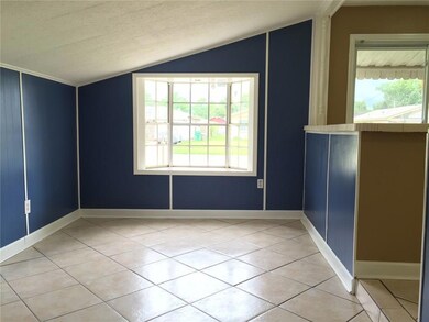 Family room with window seat overlooking front yar