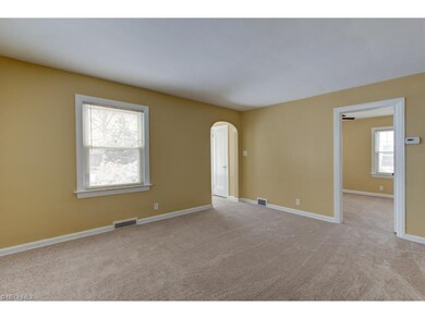 View into Bedroom off living room. All windows hav