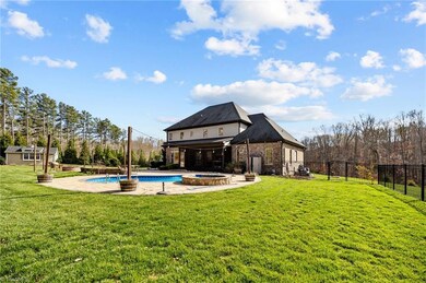 Backyard swimming pool, hot tub, hardscaping, fire pit, dining space, screened porch!
