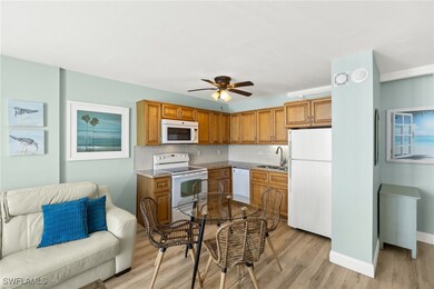 Kitchen featuring light wood finished floors, a si