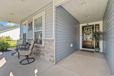 Property entrance featuring covered porch
