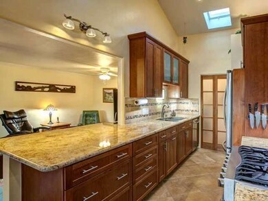 Large granite counter opens to family room