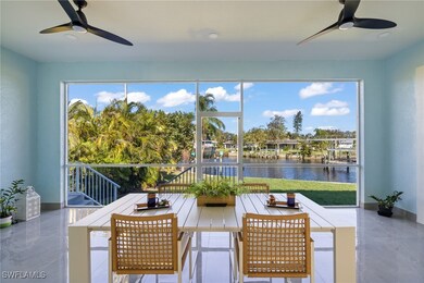 Sunroom featuring ceiling fan and a water view