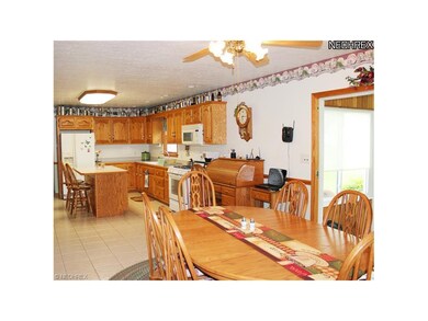 The handsome kitchen is open to both the dining an