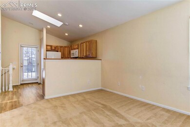 Kitchen opens up with radiant skylight