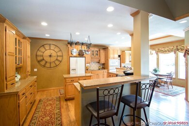 Bar seating around both sides of the kitchen for g