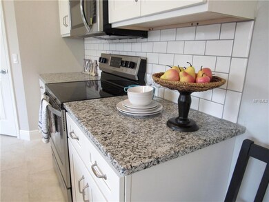Gorgeous granite counters with subway tile backspl