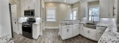 Large gourmet kitchen with granite counter tops