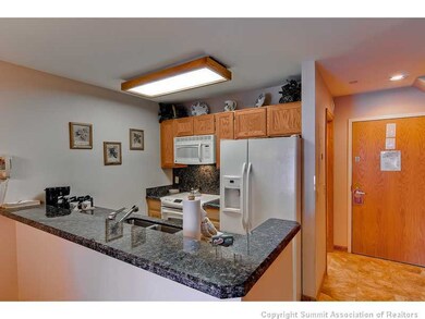 Kitchen. The beautiful new kitchen features slab granite counter tops, new appliances, and new flooring in the kitchen, foyer and bath.