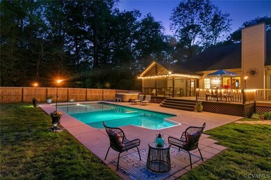 View of swimming pool featuring a patio area, a yard, and a wooden deck