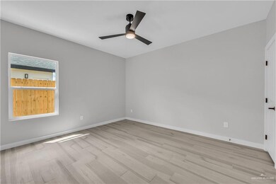 Unfurnished bedroom featuring light wood-type flooring and a ceiling fan