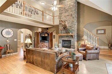 2-story Cathedral Ceiling Great Room with beautiful stone gas log fireplace.