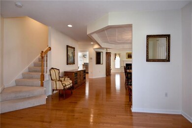 Notice the gleaming hardwood floors and open floor