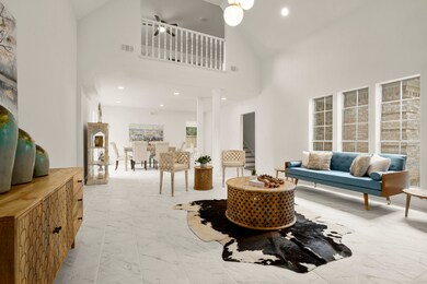 Living room open to second floor and dining room