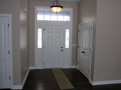 Generous entry with roomy coat closet, leaded glas