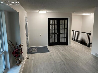 Living Room showing Entry and French Doors to Offi