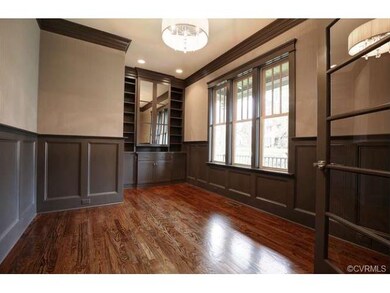 French Doors lead to Study with hardwood floors, t