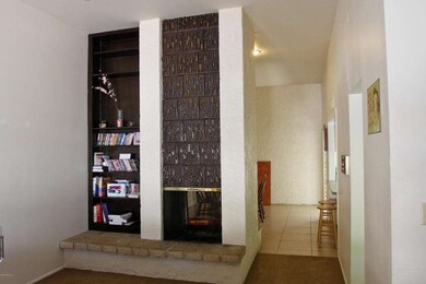 View of Fireplace and Dining Room