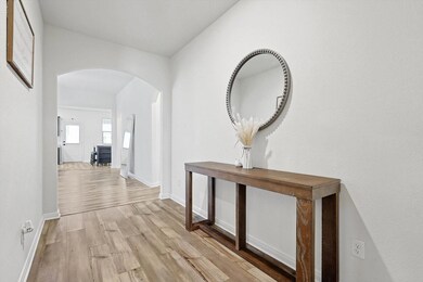 Hallway with light wood-type flooring
