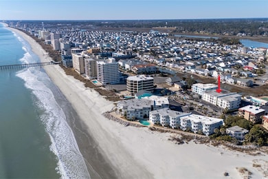 Birds eye view of property featuring a beach view 