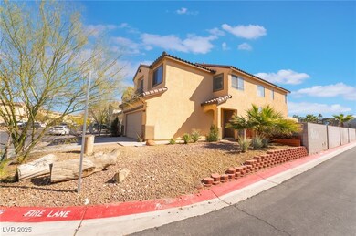 View of side of property featuring a garage, fence