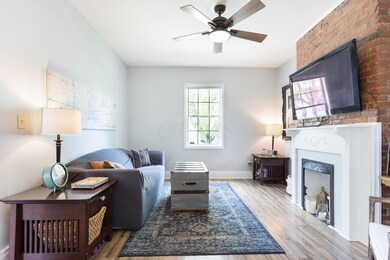 Living room with exposed brick