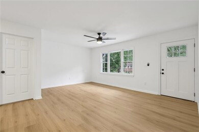 Unfurnished room with light wood-style flooring, baseboards, a ceiling fan, and recessed lighting