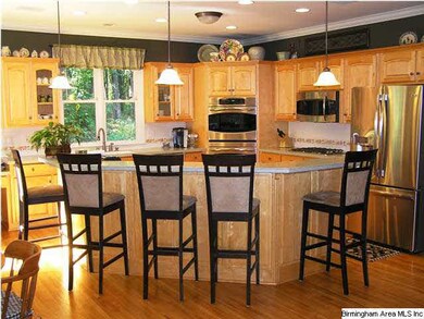 Kitchen with new stainless appliances and large is