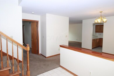 Tiled Foyer Opens up to Dining Area.