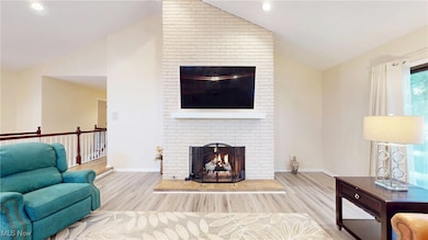 Floor to ceiling brick fireplace creates a stunning focal point