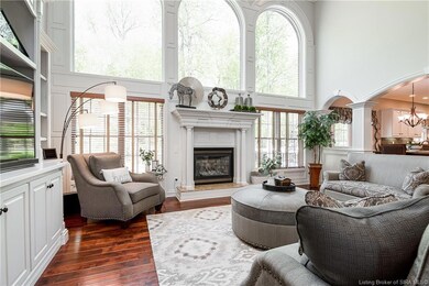 STUNNING living room with windows galore that brin