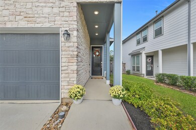 Covered entrance with a beautiful glass front door