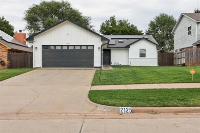 White painted exterior with dark grey accents crea