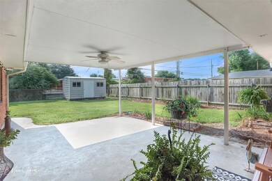 View of patio  featuring a storage unit and ceilin