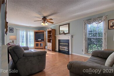 Living Room w/ Fireplace & HW Floors