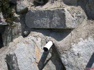 Close up of the seawall.  Riff raff, giant boulder
