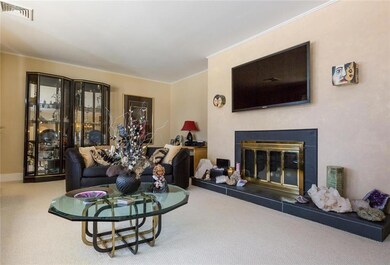 Cozy fireplace with tile surround.