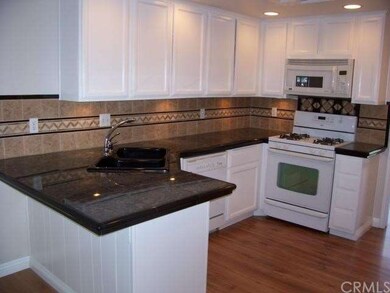 WOW! Granite tiled counter tops; decorative back s
